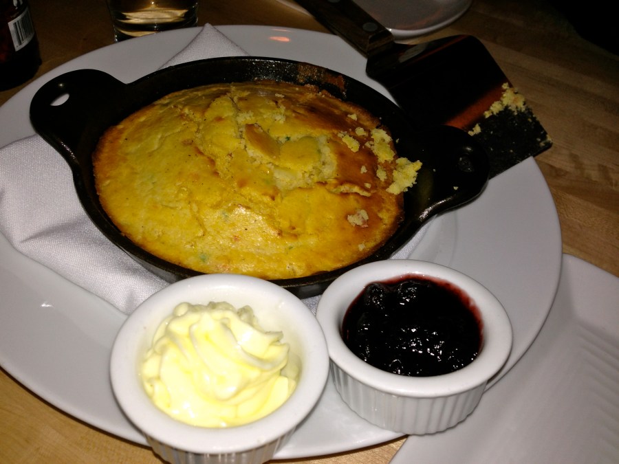 Spicy cornbread in a hot skillet.