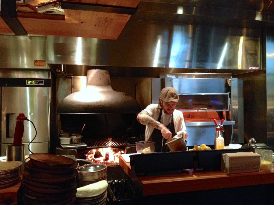 Lots of wood. They burn it and serve on it.